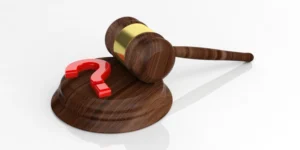 Brown Judge's Gavel With Red Question Mark