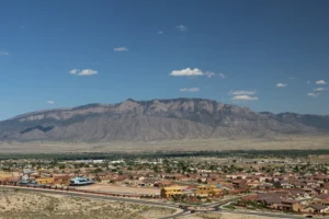 Sandia Mountain In Daylight Backdrop Over Town Of Rio Rancho