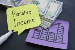 Post It With Passive Income Written In Sharpie On It In Front Of Stack Of Money